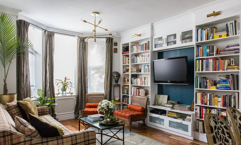 Living room bay window bookcase TV view